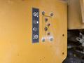 Image of a control panel from a 2012 Caterpillar 980 featuring icons for steering and operational functions