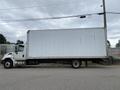 A white 2014 International Durastar box truck with a plain white cargo area and a front cabin displaying the truck's brand and model