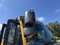 A 2011 Freightliner B2 school bus with a focus on the side mirrors and front detailing