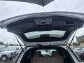 A 2016 Ford Explorer with the rear hatch open showcasing the interior cargo space and the upper storage compartment