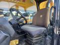 A 2013 JCB 510-56 Loadall with a brown driver's seat and controls visible in the foreground