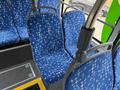 Interior view of a 2018 Grande West Vicinity bus showing blue patterned seats with metallic armrests