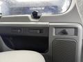 Interior dashboard of a 2013 Ford E-350 featuring controls and a speaker grille