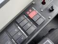 Close-up of the control panel in a 2018 Grande West Vicinity featuring various buttons such as emergency stop indicator and settings for lighting and ventilation