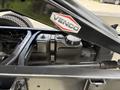 An exposed section of a 2020 Chevrolet Silverado's chassis showcasing the fuel tank and part of the suspension system
