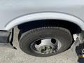 Close-up of a wheel and tire from a 2020 Chevrolet Express with visible lug nuts and a tread pattern on the tire