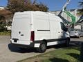 A 2021 Mercedes-Benz Sprinter 2500 van with a white exterior and black lower body trim, viewed from the rear angle