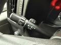 A close-up view of the windshield wiper control stalk of a 2020 Chevrolet Express showing various settings and indicators