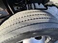 Close-up of a worn tire on a 2010 Ford F-450 showcasing visible tread wear and a clean rim without any visible damage or debris