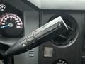 Close-up of the tow/haul mode switch on the steering column of a 2015 Ford F-450 showing indicators for gear selection and towing features