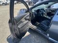 2017 Nissan Murano with an open driver door showing a black leather interior and dashboard features