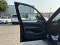 A 2013 BMW X3 with an open driver's door showcasing the interior details such as the dashboard and seats