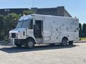 A 2008 Workhorse W62 vehicle with a large rectangular body featuring multiple access doors and a driver side door open