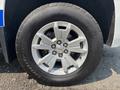 A close-up of a silver alloy wheel from a 2017 Chevrolet Colorado featuring a black tire with the Goodyear Advantage label