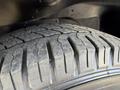Close-up of a tire from a 2017 Chevrolet Express showing tread patterns and rubber texture