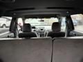 Interior view of a 2019 Ford Explorer showing the back seats and dashboard with controls and air vents visible