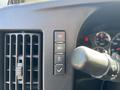 Dashboard controls and air vent of a 2019 GMC Savana displaying buttons for various functions