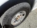 Close-up view of a tire and wheel of a 2017 Chevrolet Express showing the tread pattern and metallic wheel rim