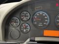 Dashboard of a 2013 International Workstar 7500 displaying gauges for RPM water temperature transmission and oil levels