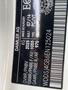 A label displaying vehicle identification numbers and manufacturing details for a 2014 Mercedes-Benz CLA-Class vehicle