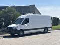 A 2019 Mercedes-Benz Sprinter van with a white exterior and black accents parked in a sunny area