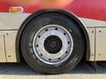 A close-up of a tire on a 2016 Grande West Vicinity bus showing the wheel rim and tread detail