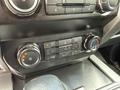 The image shows the climate control interface of a 2019 Ford F-150 featuring buttons for temperature adjustment and air conditioning settings