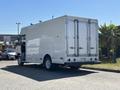 A 2019 Freightliner MT45 delivery truck with a white body and double rear doors parked at an angle