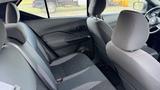 Interior view of the backseat of a 2019 Nissan Kicks featuring two seats with black fabric and gray stitching