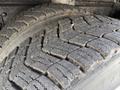 Close-up of a worn tire tread from a 2008 Kenworth T370 showcasing distinct patterns and grooves