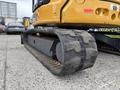 A 2017 John Deere 50G excavator with a highlighted rubber track and undercarriage details