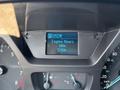Dashboard display of a 2016 Ford Transit 150 showing engine hours with a reading of 590h and gear selector indicators