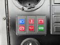 Control panel featuring six buttons in various colors for the 2004 Bombardier SW48 including indicators for lights, water, battery, parking, oil, and a green signal