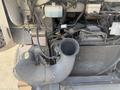 A close-up view of the engine compartment of a 2009 Workhorse W62 showing various components including an air intake hose and radiator.