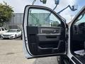 A 2016 RAM 5500 truck door is open showcasing the interior features and door panel design
