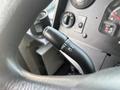 Close-up of the steering column controls in a 2018 Ford Econoline including the turn signal and wiper controls