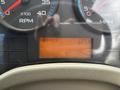 Close-up of the dashboard of a 2013 International DuraStar 4300 showing RPM and speedometer gauges along with a display indicating 22576 miles driven