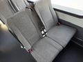 A gray upholstered bench seat with seat belts designed for a 2021 Ford Econoline van