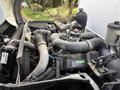 Close-up view of the engine components of a 2008 International CityStar including hoses pipes and a turbocharger
