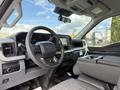 Interior view of a 2024 Ford F-550 showing the steering wheel instrument cluster and dashboard with controls and a gear shift