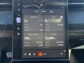 Dashboard display of a 2023 Fisker Ocean showing trip information, including charge status, current trip metrics, and odometer reading