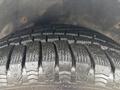 Close-up of a tire tread on a 2019 Ford Transit Connect showcasing deep grooves and patterns for traction