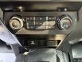 The control panel of a 2020 Ford F-350 SD featuring climate control dials and air conditioning settings