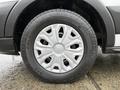 A close-up of the wheel of a 2019 Ford Transit featuring a silver rim with a distinctive design and a black tire with visible tread patterns