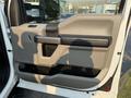 The image shows the interior door panel of a 2021 Ford F-350 SD featuring a blend of textured materials and controls