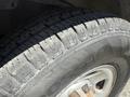 Close-up of a tire from a 2017 Chevrolet Express showcasing tread pattern and brand details