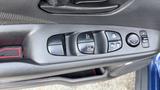 Close-up of the window and door lock control panel in a 2019 Nissan Kicks featuring multiple buttons for windows and locks