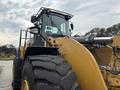 A 2012 Caterpillar 980 wheel loader with large tires and a hydraulic front bucket designed for heavy lifting and earthmoving tasks