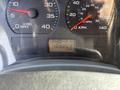 The dashboard of a 2006 International 4300 showing speedometer, tachometer, and odometer reading 100863 km