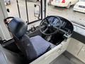 Interior view of a 2016 Grande West Vicinity bus showing the driver's seat steering wheel and control panel